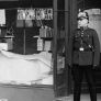 Police man in front of a store, 10 November 1938 in Berlin